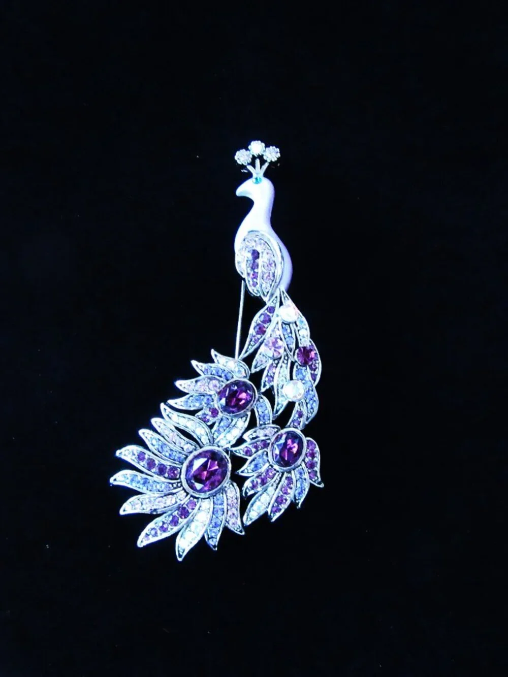 Peacock brooch with purple and aurora borealis rhinestones in silver setting